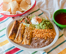 Toasted enchilladas with mexican rice and refried beans